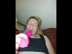 Horny femboy slut cums hard all over themselves while deepthroating a dildo