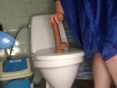 Curvy MILF pissing and fucking her dildo in the toilet