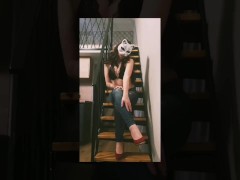 Teaser. Vera Mill on Stairs wearing jeans and  White thongs