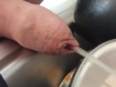 Closeup foreskin pissing on dishes