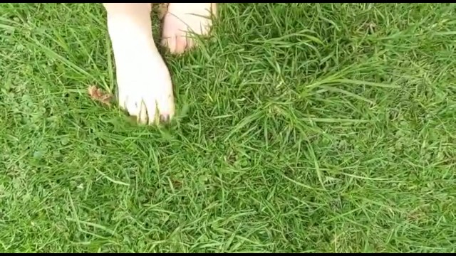 two sexy pairs of feet stepping on crunchy fall leaves