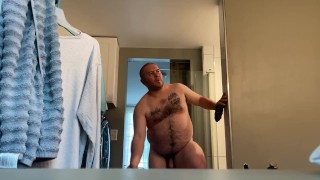 Preparing For A Shower A Fat Man