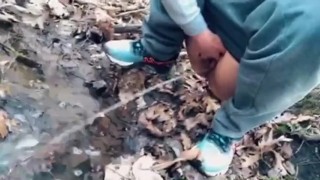 Public Piss After A Run A Teen Pisses In A Forest Stream