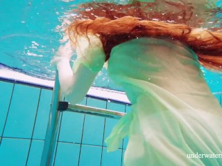 Hairyteen babe Nina Mohnatka swims in the_pool