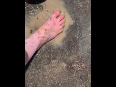 Cleaning my muddy feet with hose