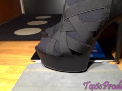 High heels toying with Ipad
