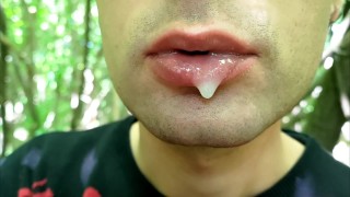 Outdoor Close-Up Of A Man Playing With Cum On His Lips Blowing Cum Bubbles And Swallowing It All