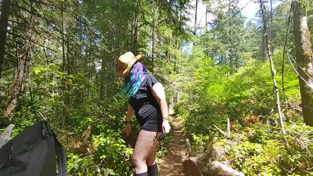 Blue haired Milf in fishnets pissing on public trail 38