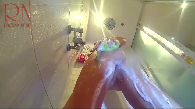 Voyeur camera in the shower. A nude girl in the shower is washed with soap. 17