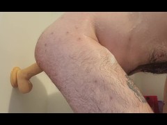 Riding a huge dildo in the shower 