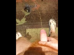 Hairy ginger guy pissing on a rug