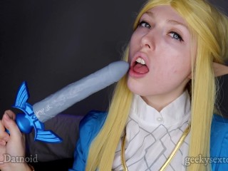 Screen Capture of Video Titled: Zelda Unboxes The Master Dildo! GeekySexToys Unboxing