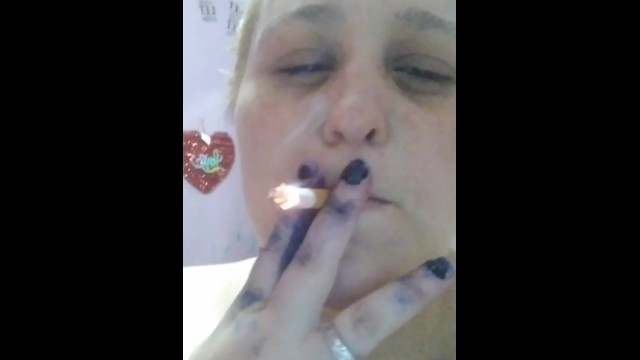Smoking a cigarette shirtless 9