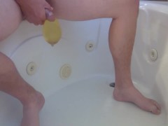 Pissing into a condom in the bathtub #87