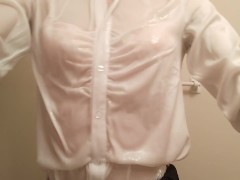 Taking a shower while crossdressing. (pink bra is seen through the blouse)