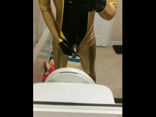 Peeing through chastity in catsuits