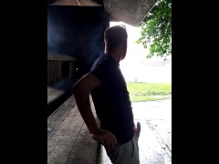 Smoking and playing with floppy cock while it rains