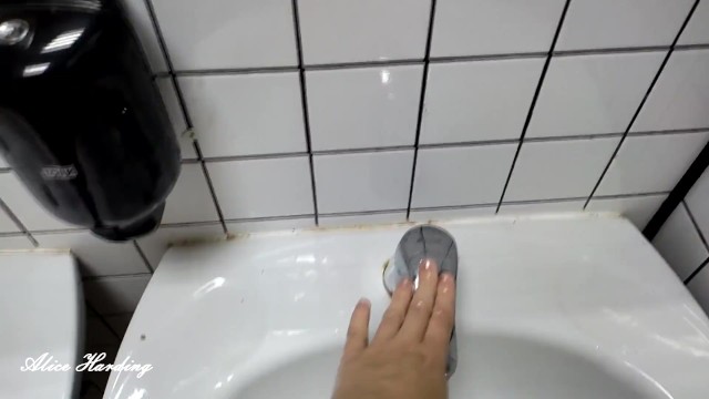 Alice lathers her pussy after using a public toilet in the washbasin 20