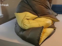 Down Fetish Puffy Jacket Lover Humping Huge Brown Sleepingbag on Bed. Teaser