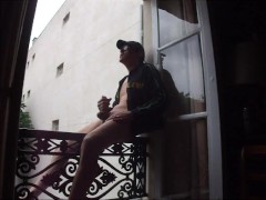 wanking on balcony
