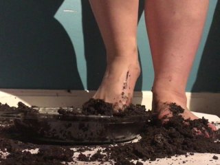 Screen Capture of Video Titled: Sexy Girl with Lovely Feet TRAMPLES, SPLOSHES Her Cookies!