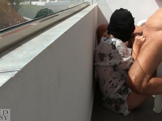 Public Blowjob on Sunny Balcony_makes him cum fast, while strangers walking by during_his cumshot