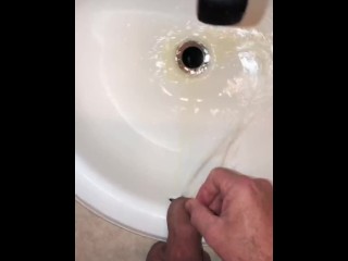 Naughty Pissing and Cumming in my bathroom_sink featuring a bullseye cumshot into thedrain