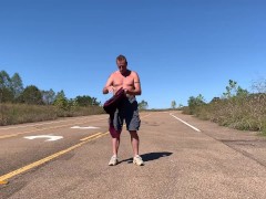 Stripping naked on a public road and jacking off before getting dressed again.