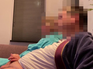 Casual handjob from wife while watching tv on couch