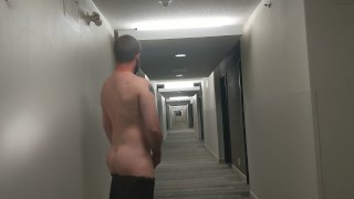Cumming in hotel hallway