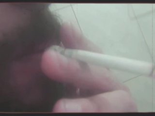 Bearded Man Smoking And Shaving His Pubic Hair