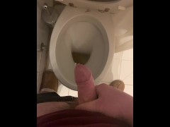 a guy pisses and then masturbates in the bathroom