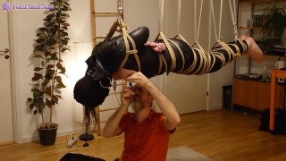 Girl in leather catsuit gets Shibari energy tied, suspended, nipple clamps. Real uncut play!