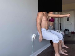 Fit couple doing wall squats to failure