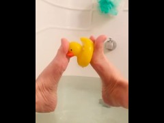 Innocent bath with rubber ducky