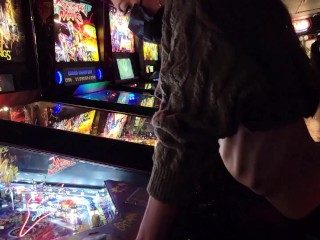 Brazenly flashing boobs in a busy arcade