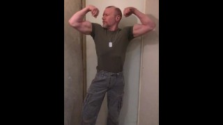 Hunk Muscular Army Man Flexing His Biceps And Preparing To Fight