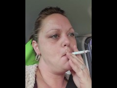 HOT Babe having a smoke while waiting in the car