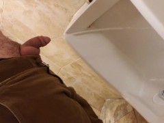 Pissing in urinal