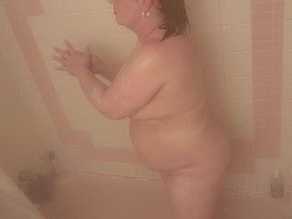 Sexy brunette MILF sneaks in a few orgasms and a couple cigarettes in the shower... almost caught!