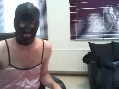 Gay man in women's clothing and leather mask jerks off cock and cums in panties