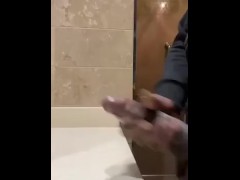 Huge cumshot in public bathroom