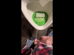 Pissing into a urinal in a pub. I play football with urine