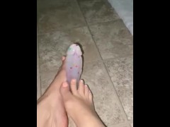 Giving my dildo a footjob with my sexy feet