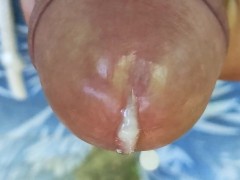 Close up cumming out of glans