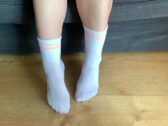 Sexy girl shows her pretty white sport socks after walk