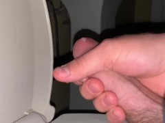 Shooting a big load into the toilet
