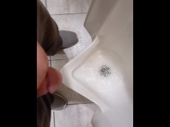 Pissing at a grocery store mens room