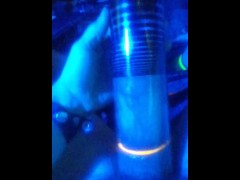 pumping dick and balls into penis pump under blue light