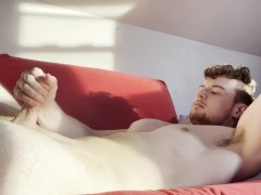 Solo male jerking his big cock on the couch